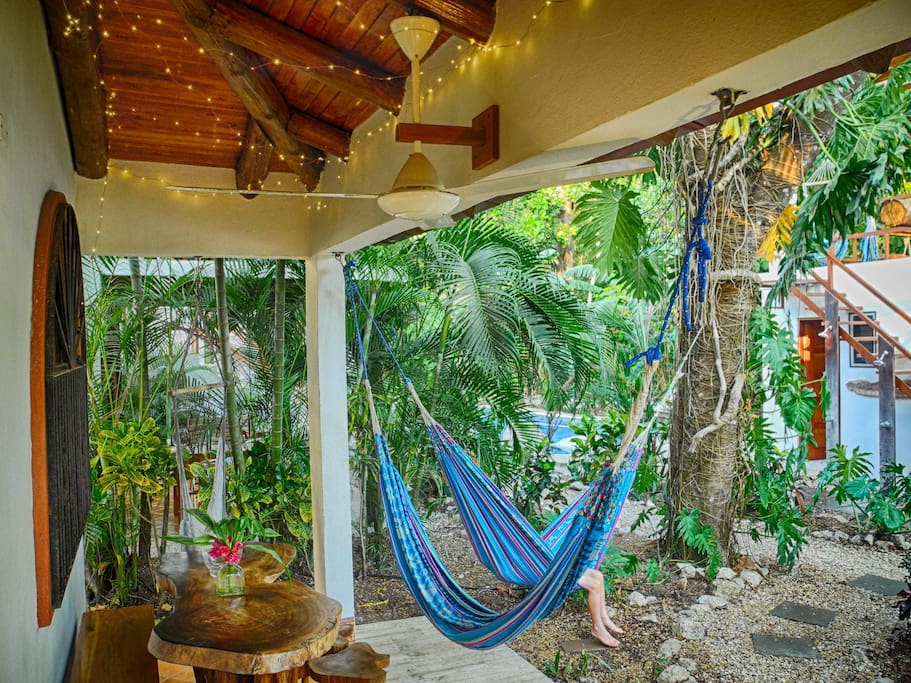Enjoy hammocks on your patio while you look out to the garden and out to the pool, steps away.