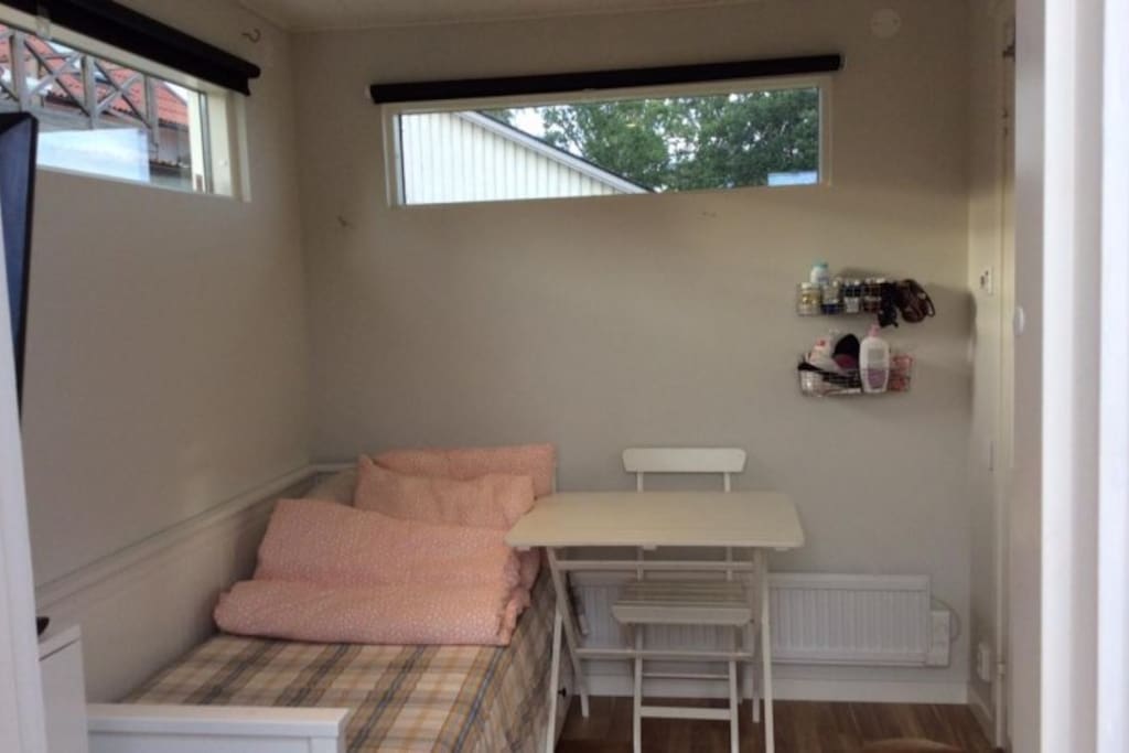 Bed sofa and small table, sofa could be converted into a double bed but space become small with out floor space, Only for a couple or
a single person.