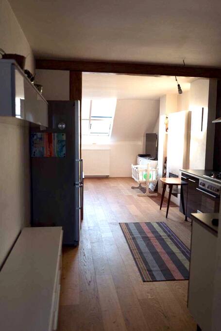 you can see the fireplace after the kitchen