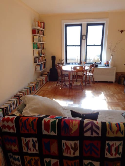 Living room and sunny breakfast area.