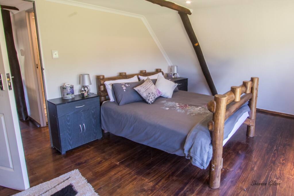 Main Suite Upstairs with Faux Leather Sleeper Couch & HDTV with Full DSTV