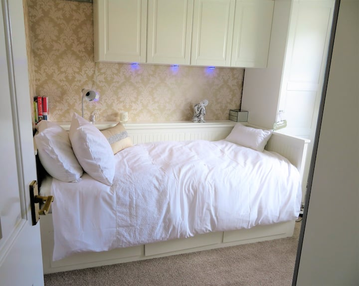 The second pretty bedroom has a single bed that makes into a double if you pull out the bottom.