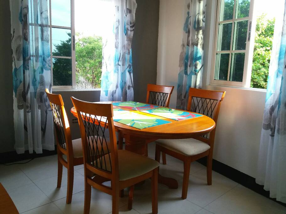 Dining area by the window seats four.