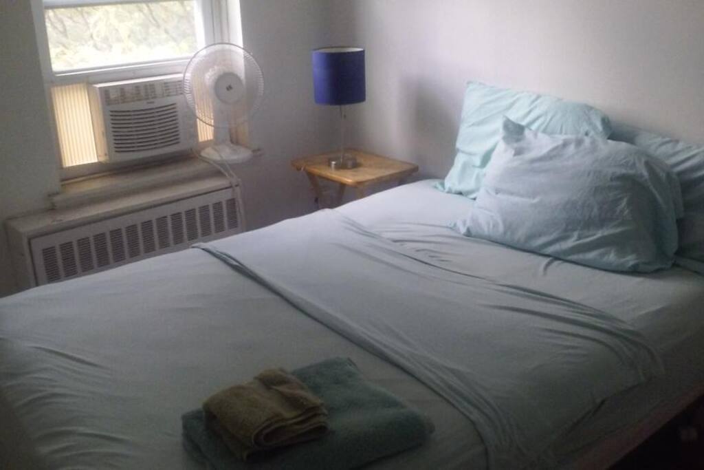 full sized bed, towels, and an air conditioner for those hot summer nights!