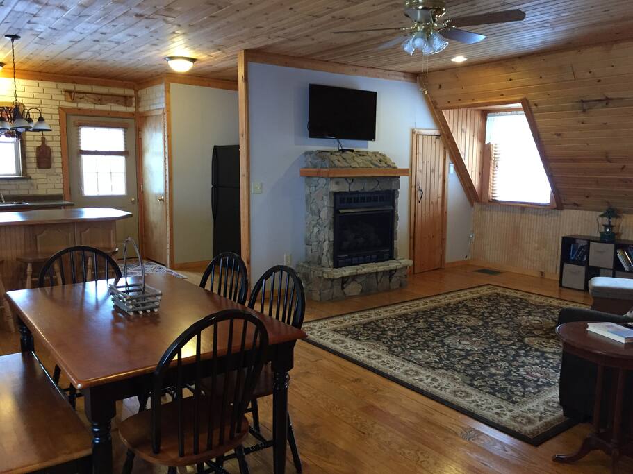 Dining area, fireplace, and flatscreen TV