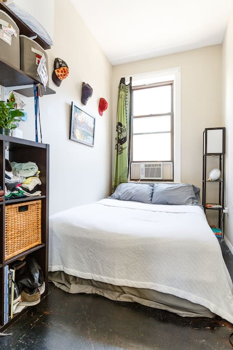 The bedroom features a queen size bed which comfortably sleeps two. Not pictured: desk that folds out of the right wall which can be used for study/work.