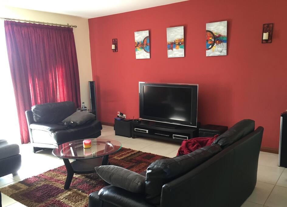 Other View of Living Room with Plenty of Seating Area Overlooking Front Balcony.