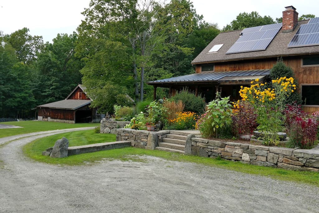 this is my home. the guesthouse is located in the barn style garage in the back. Summer.