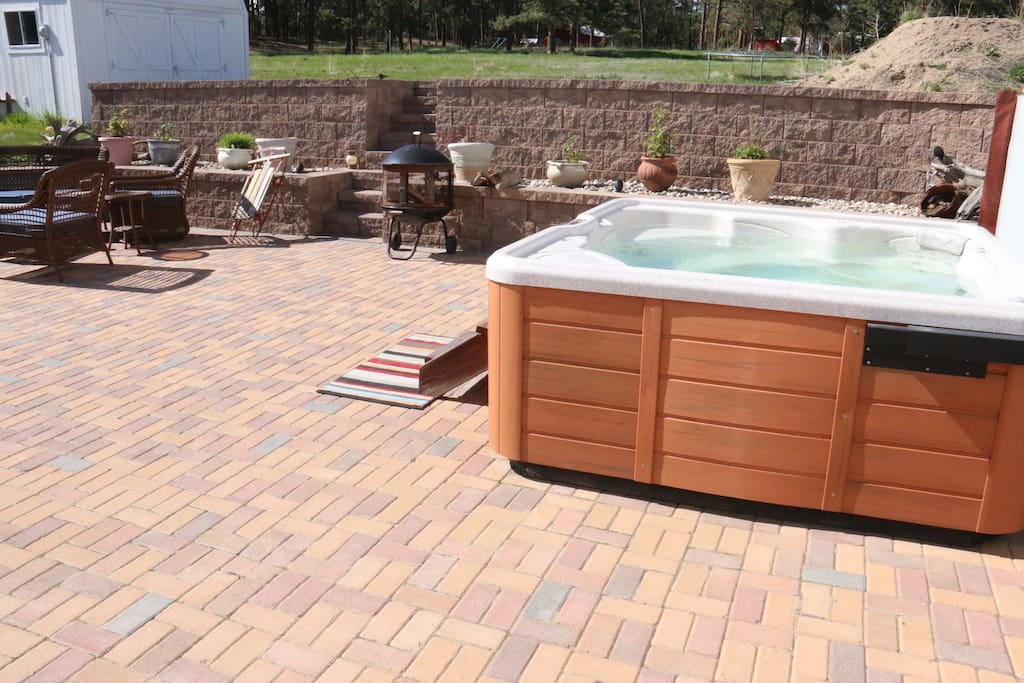 The 8 person hot tub on the large western brick patio. A wonderful space for relaxing!
