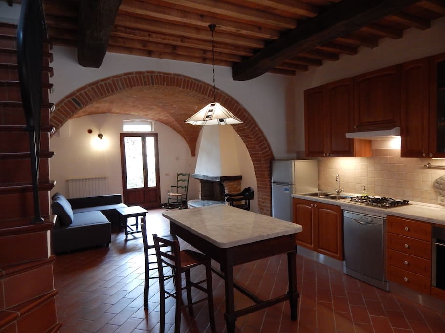 Newly renovated kitchen with marble countertops and all new appliances, including oven and dishwasher.