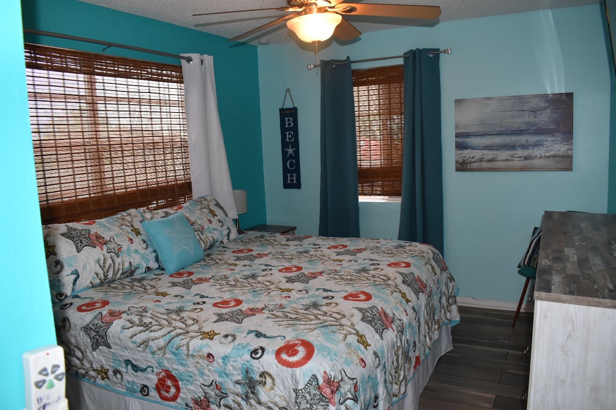 Bedroom 2 in Unit #3 with King size bed, blackout curtains and smart TV