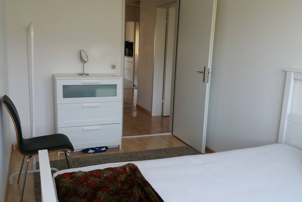 Bedroom has chest of drawers, Clothes hanger