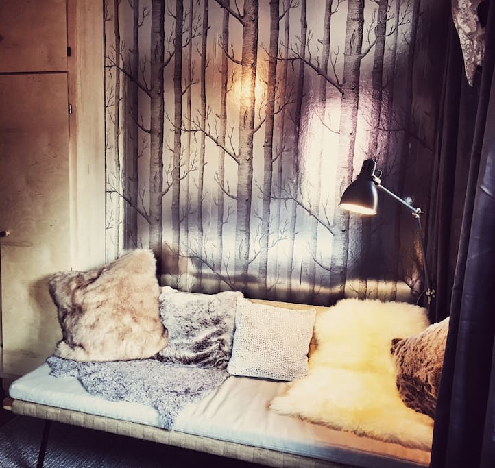 The stunning retro wallpaper adds so much to this room