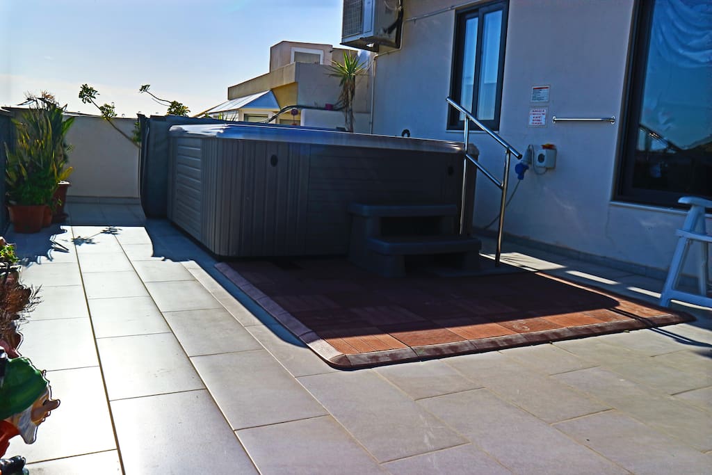 Large terrace with Jacuzzi, enjoying unobstructed sea and country views