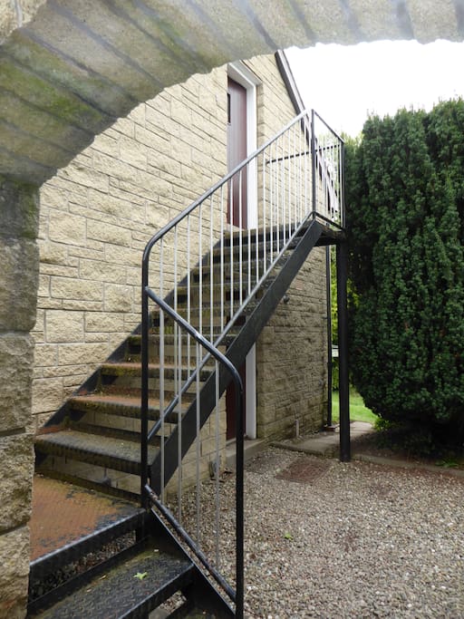 Entrance via external metal stairs