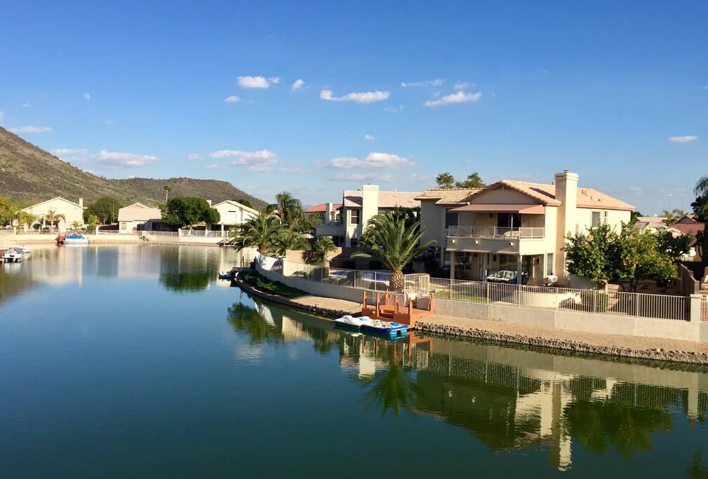 Home on the lake with mountain views and heated pool!