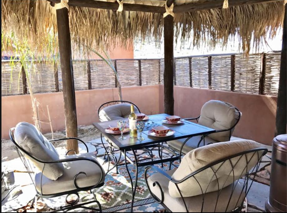 Outdoor palapa-covered dining area for 4.