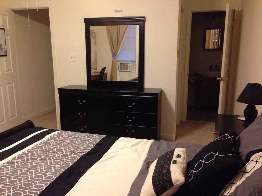 The room features a closet and private full bath (the two doors on the right in this picture).