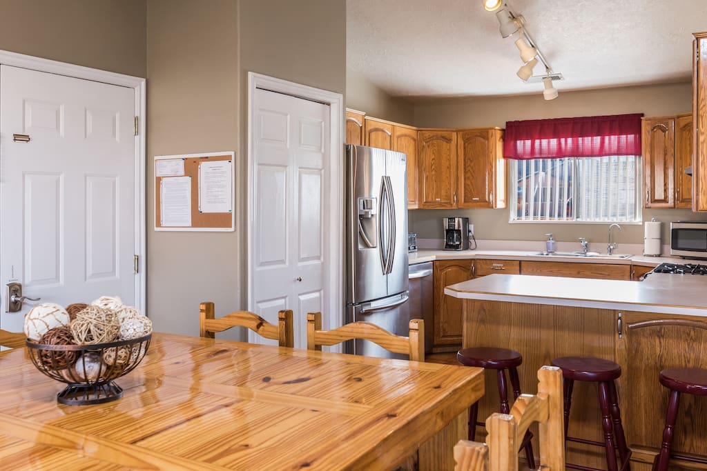 This beautiful kitchen will seat your group with 8 at the table and 3 at the bar.