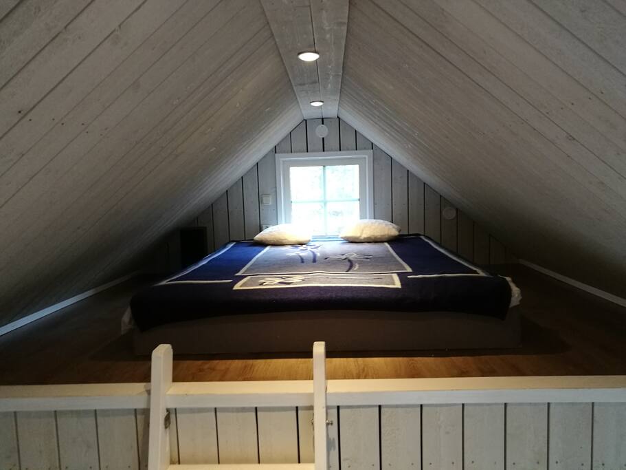 On the loft there is a large bed for two people.