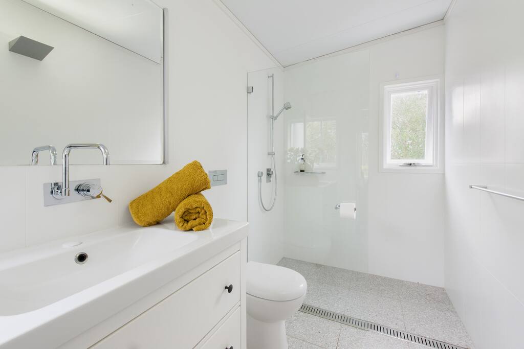 Parent retreat private shower and toilet room.