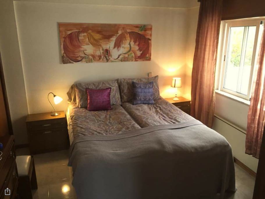 Quiet sleeping room with a very comfortable bed, and with a lot of wardrobes and Mirrors.