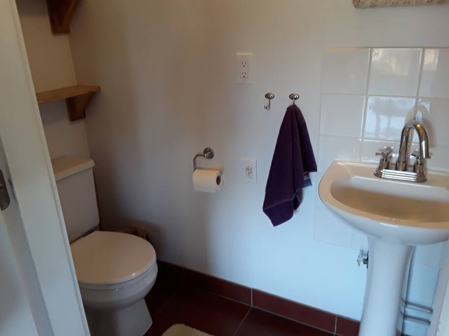 Toilet in full bathroom.