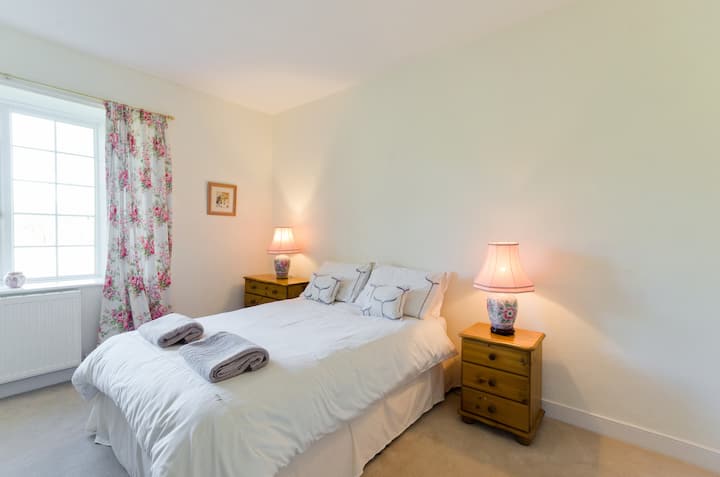 Upstairs double ensuite bedroom with drawers and hanging space