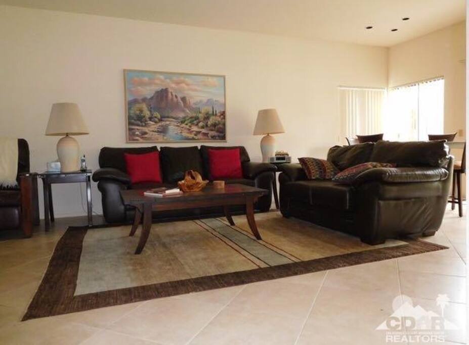 Living Room sitting area from the view of the hallway.