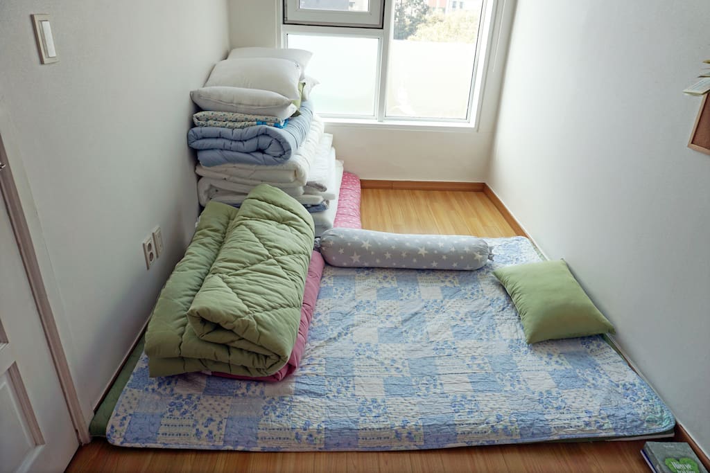The bedroom has 3 folding type bedding sets (queen size).