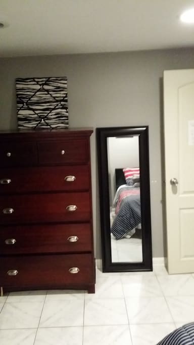 Spacious 5 drawer dresser to keep clothes well organized and a full size mirror.