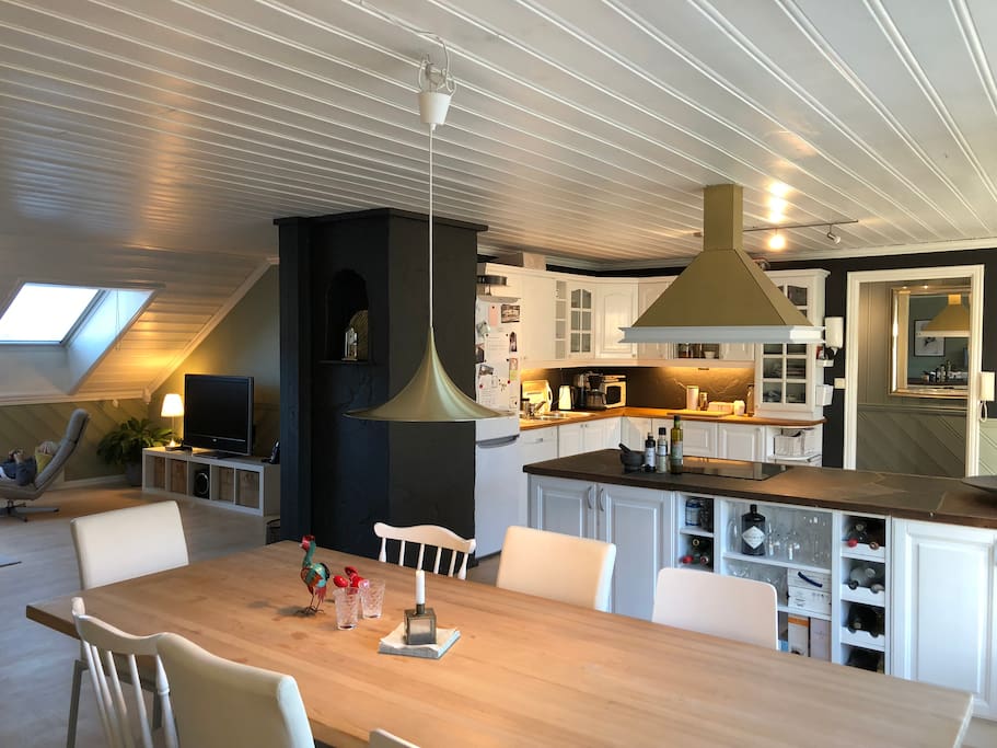 Kitchen with dining table seating 8. Open space with living room