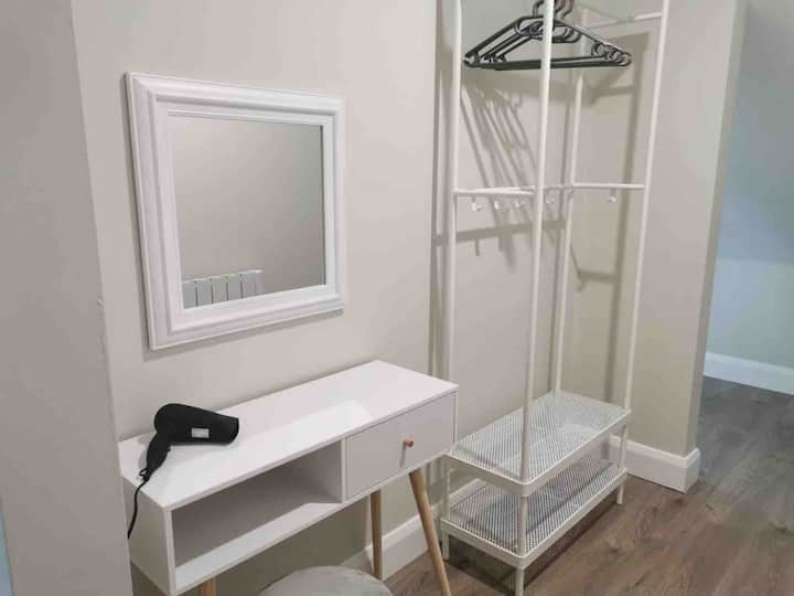 Private dressing area behind the bedroom 