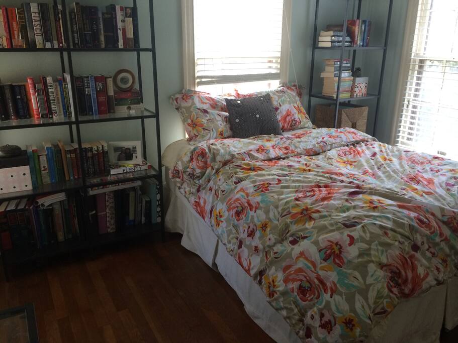 The back bedroom (yours!) gets amazing morning light and has a great library.