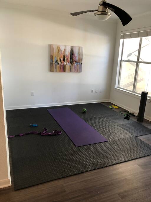 The apartment does not have couches or a tv, but it does have a sweet spot to get your workout in or do some yoga and foam rolling.