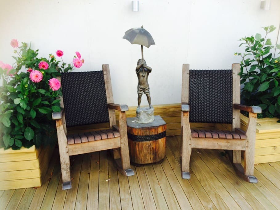 Decked patron area. Two rocking chairs