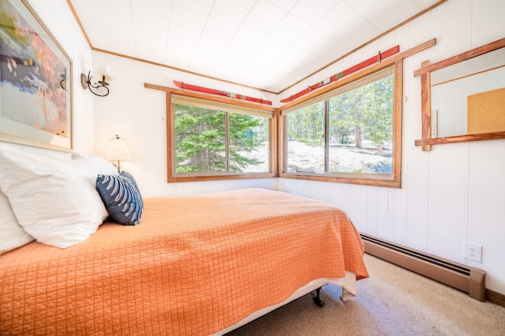 The first floor full bedroom offers incredible views into the forest on our ten secluded, private acres.
