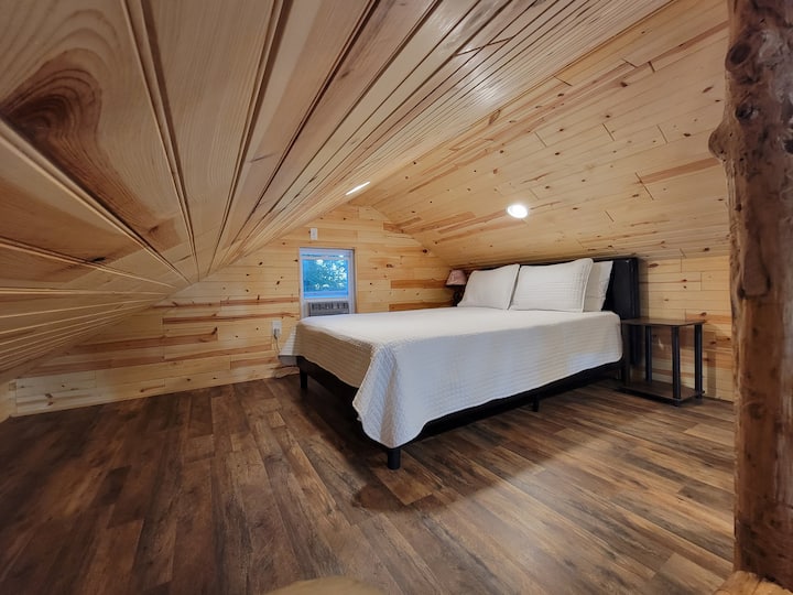 Queen sized bed in loft area