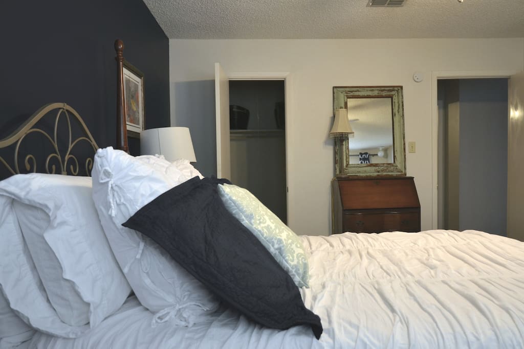 Lots of comfy pillows, pillow top mattress, walk in closet with shelves and hanging space.
