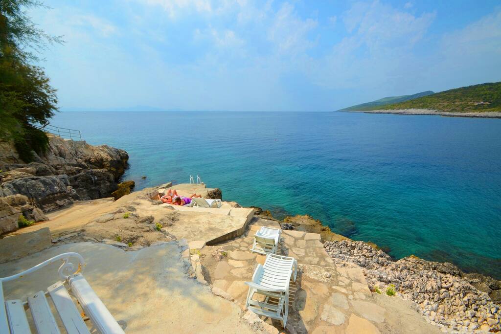 private beach with loungers
