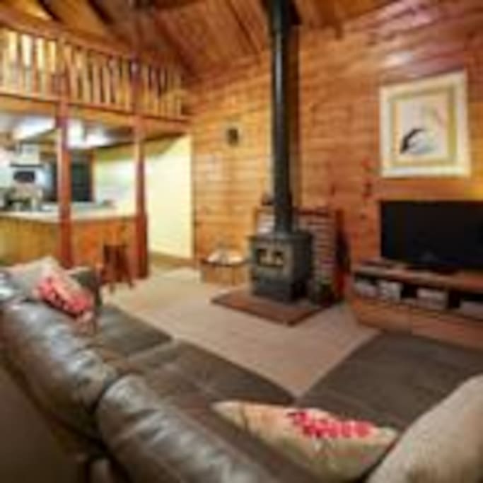 Lounge with kitchen in background