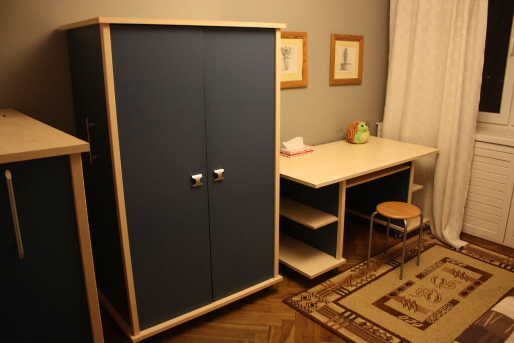 It has a wardrobe, shelves and a big desk that will be a good place to work.