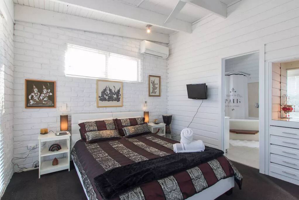 Room 1: Comfortable Queen Size bed upstairs. Includes clean towels, bed linen, pillows, air-conditioner, ceiling fan and bedside lamps.