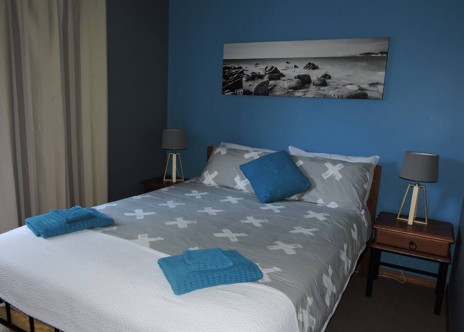 A fresh, comfortable room with plenty of built in cupboard space