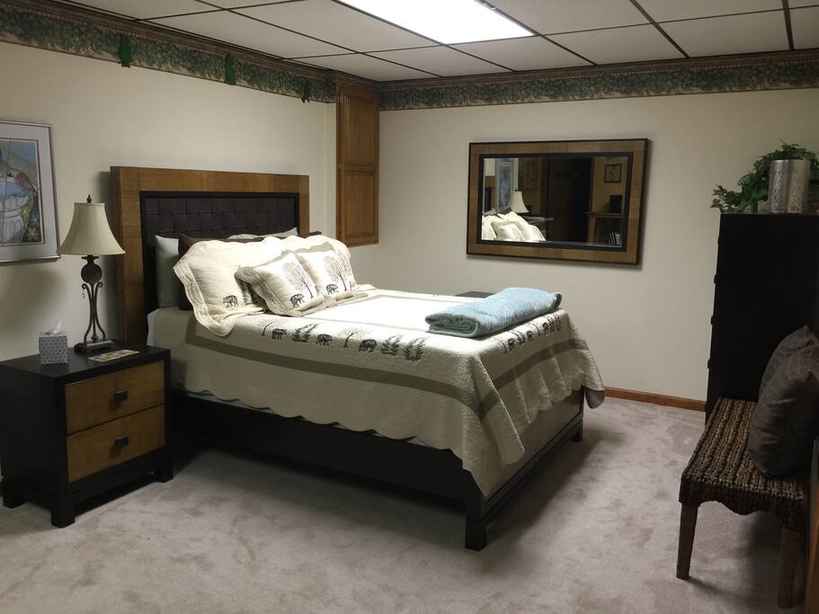 Queen bed with premium mattress and linens.