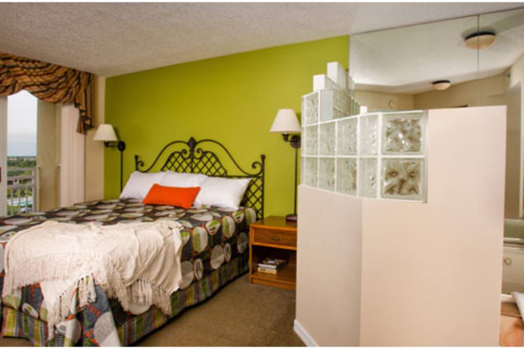 A side master bedroom with balcony