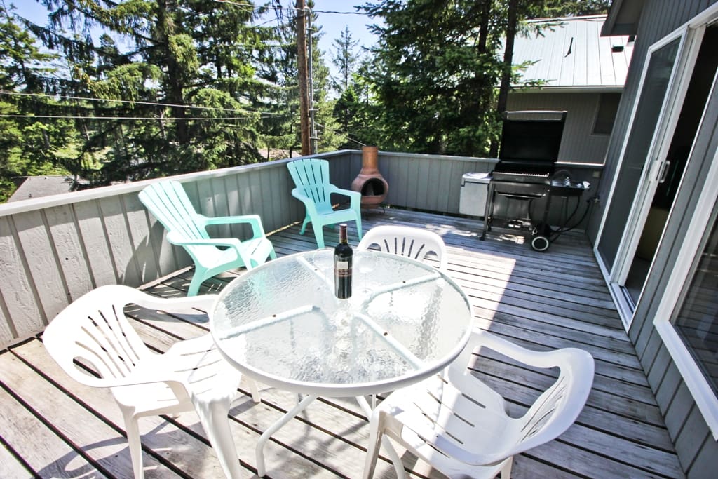 Upper deck with a patio table/chairs, gas BBQ and portable outdoor fireplace