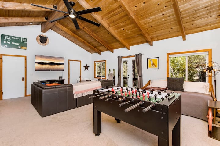 Bedroom #1 / Family Room / TV Game Room (Lower Level): Big bedroom has 6 beds to sleep 8 people, foosball, game table, and 65" Roku smart TV with sitting area.