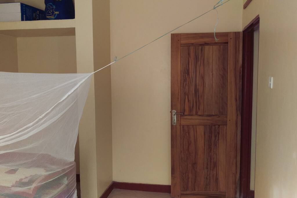 Bed has mosquito net and door is with lock and key