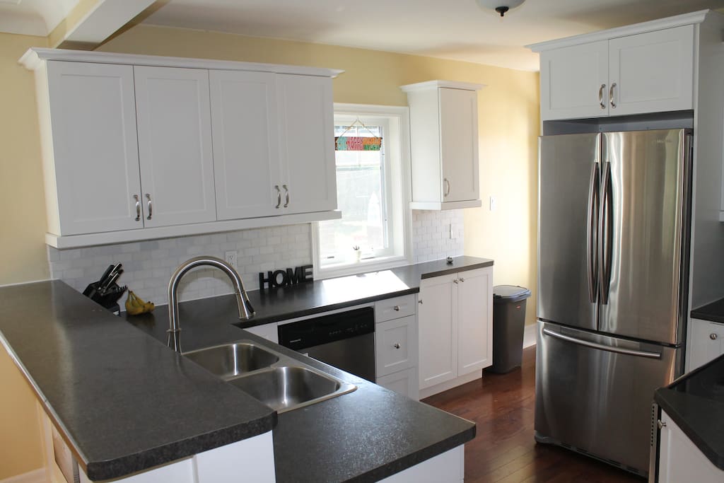 The kitchen is bright and has stainless steel appliances. The cupboards all filled with all the dishes and cooking pots and pans you need to prepare your meals. We provide essentials like oil, spices, coffee, tea, etc.